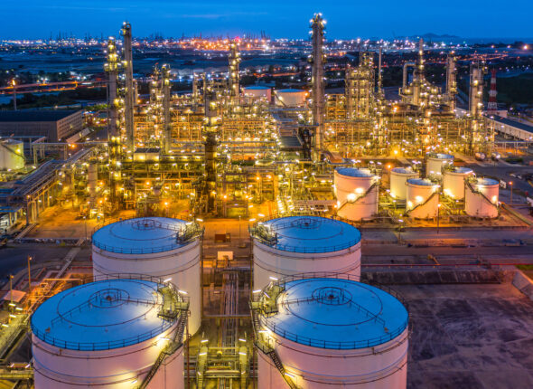 Aerial view petrochemical plant and oil refinery plant background at night,  Petrochemical oil refinery factory plant at night.